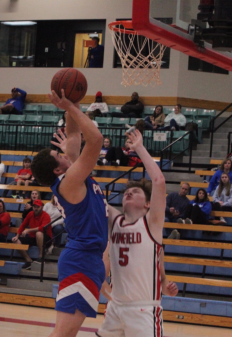 Senior center Hunter Berendzen starts the fourth quarter with a layup over the Winfield defender. Berendzen had 16 points and nine rebounds in California's win over Winfield on Saturday afternoon. (Democrat photo/Evan Holmes)