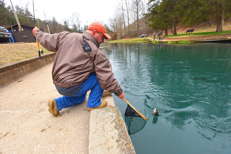 Anglers have plenty of room on Dec. 2, 2022, while fishing for trout at Roaring River State Park near Cassville, Mo. The park offers catch-and-release trout fishing four days each week from mid-November through mid-February. (NWA Democrat-Gazette/Flip Putthoff)