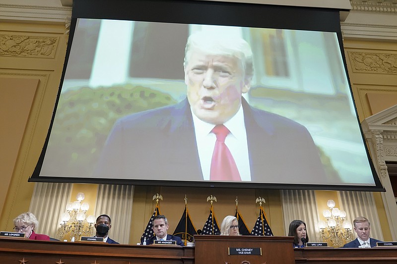 FILE - A video of former President Donald Trump speaking on Jan. 6, 2021, plays as the House select committee investigating the Jan. 6 attack on the U.S. Capitol holds a hearing at the Capitol in Washington, July 21, 2022. The House Jan. 6 committee is shutting down, wrapping up a whirlwind 18-month investigation of the 2021 Capitol insurrection and sending its work to the Department of Justice along with a recommendation for prosecuting the former president. (AP Photo/Patrick Semansky, File)