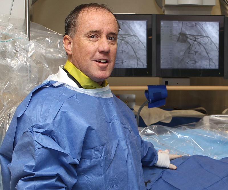 Dr. Jeffrey Tauth, shown in the NPMC cath lab on Dec. 12, 2011, has agreed to settle allegations of him inserting non-medically necessary cardiac stents for Medicare patients. - File photo by The Sentinel-Record