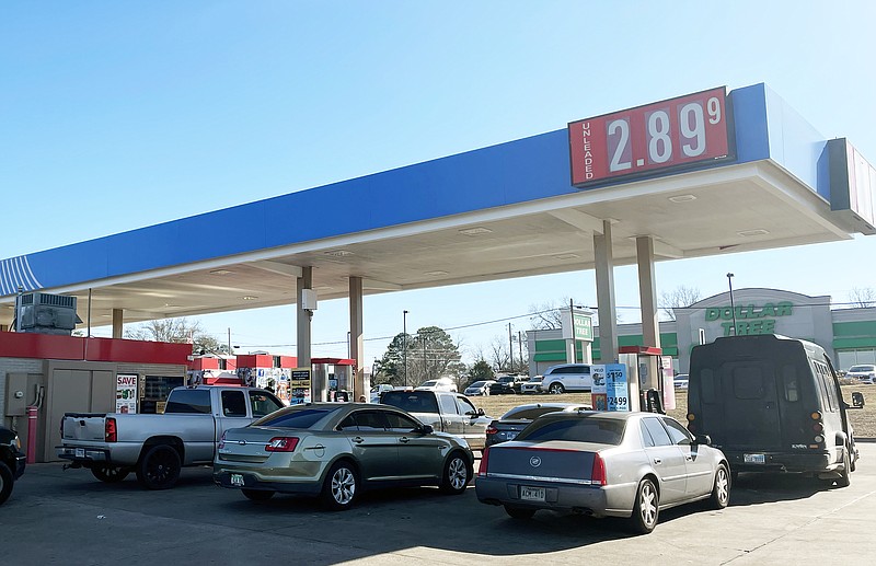 Motorists line up for fuel Friday, Jan. 6, 2023, at Walmart on Arkansas Boulevard in Texarkana, Arkansas. The average regular gasoline price increased by $0.153 per gallon, from $2.891 to $3.044, in the city over the preceding week, according to AAA. (Staff photo by Karl Richter)