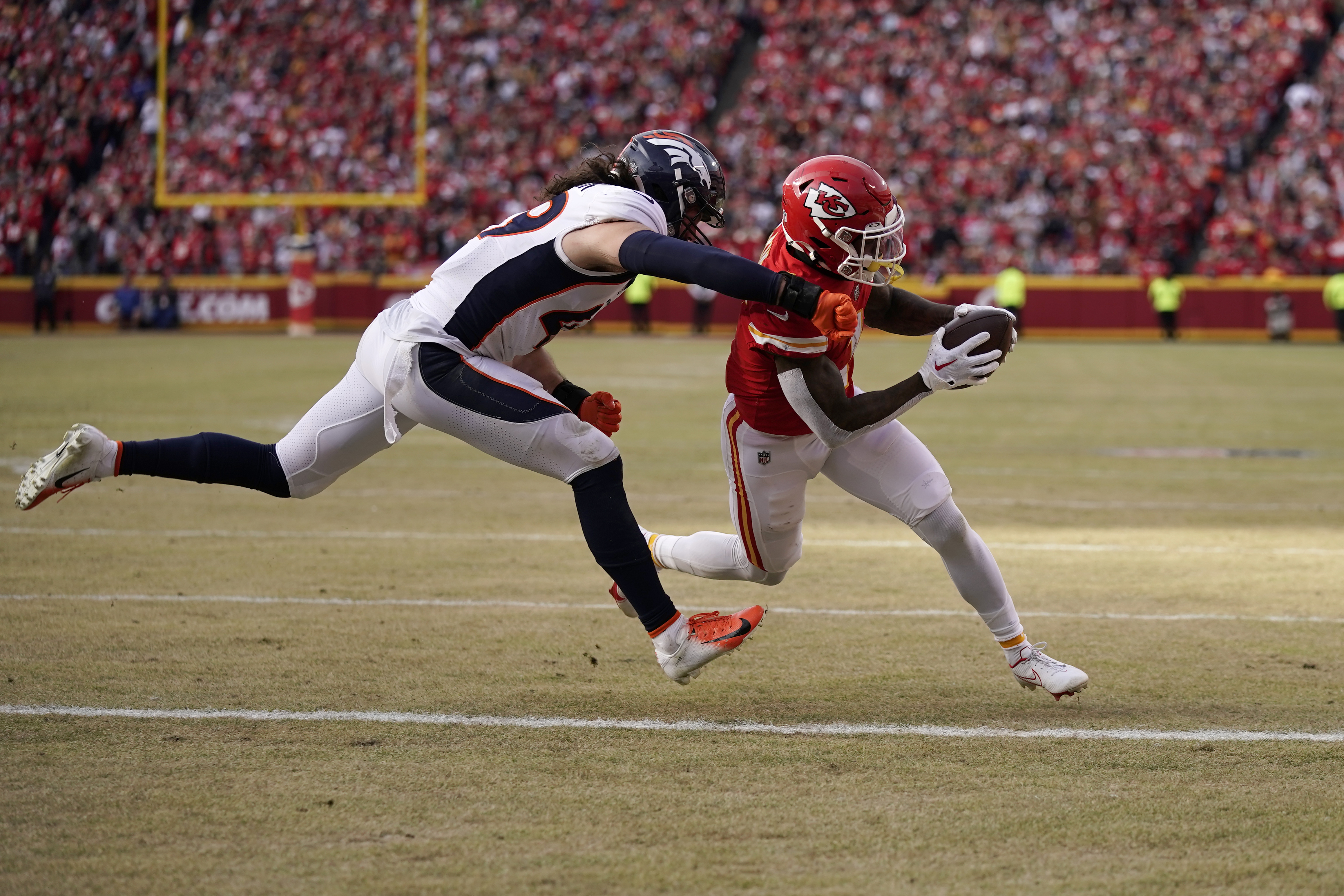 Chiefs grind out a win in Denver, secure #2 seed in AFC