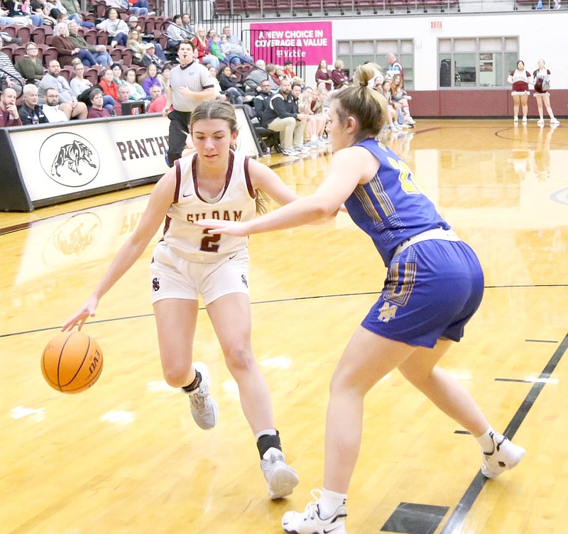 Mark Ross/Special to the Herald-Leader
Siloam Springs senior Anna Wleklinski (left) works against Mountain Home sophomore Lakyn Moore during a game on Friday, Jan. 6, at Panther Activity Center. The Lady Panthers defeated the Lady Bombers 52-47.