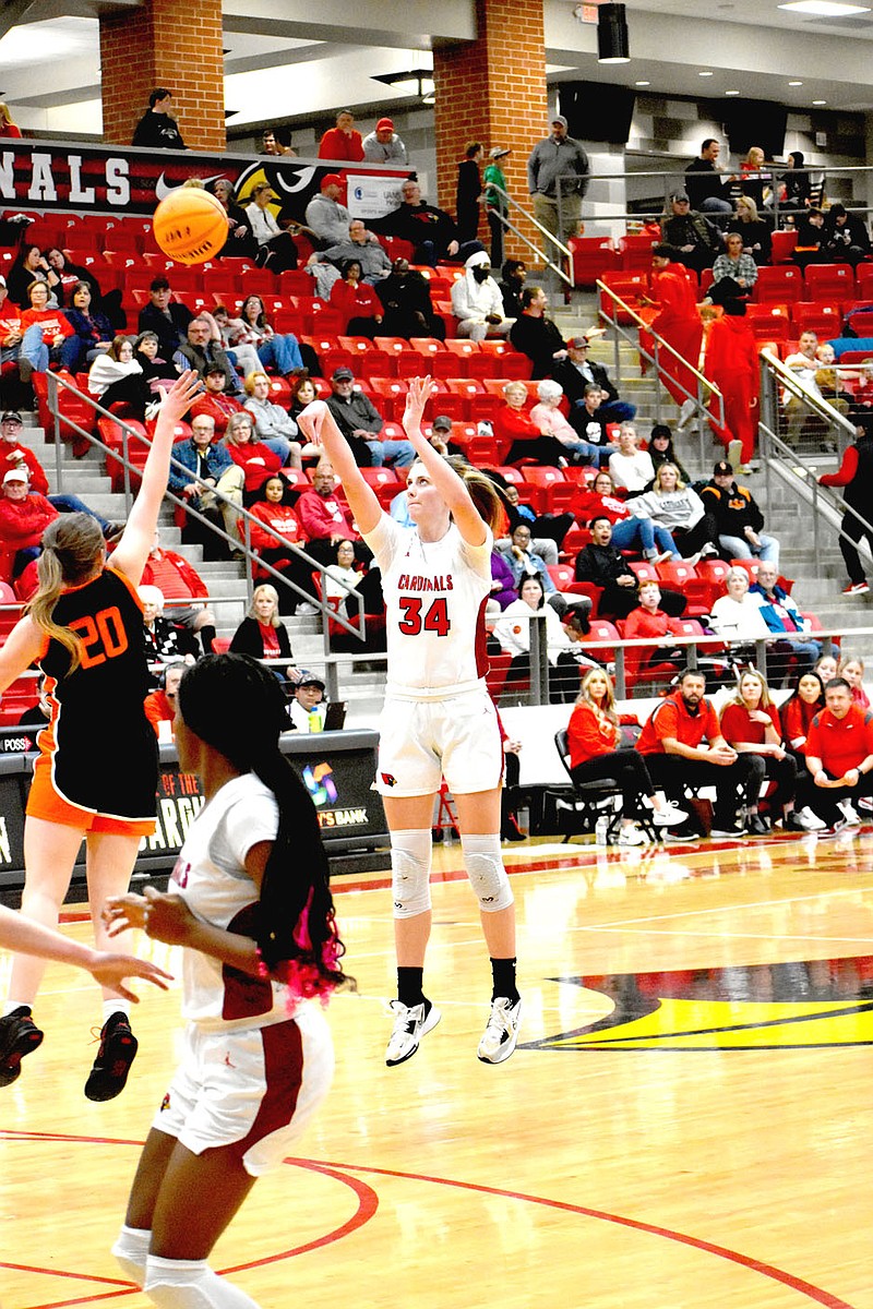 MARK HUMPHREY  ENTERPRISE-LEADER/Farmington senior Jenna Lawrence gets off a 3-point shot during the Lady Cardinals' 81-51 girls basketball 4A-1 Conference win over Gravette Friday at home. Lawrence hit four 3-pointers and scored 24 points.