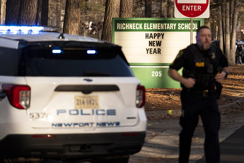 Police respond to a shooting at Richneck Elementary School, Friday, Jan. 6, 2023 in Newport News, Va. A shooting at a Virginia elementary school sent a teacher to the hospital and ended with &#x201c;an individual&#x201d; in custody Friday, police and school officials in the city of Newport News said.&#xa0;(Billy Schuerman/The Virginian-Pilot via AP)