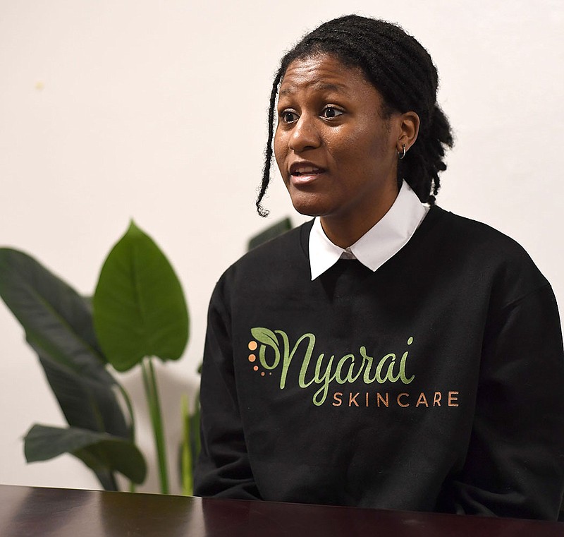 Warrenesha Arnold, a University of Arkansas student from Marianna, speaks Wednesday, Dec. 14, 2022, about the skin care business she started and operates out of the Startup Village in the Hathcock Building in downtown Fayetteville. Visit nwaonline.com/photo for today's photo gallery. 
(NWA Democrat-Gazette/Andy Shupe)