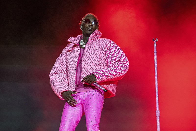 FILE - Rapper Young Thug performs on Day 4 of the Lollapalooza Music Festival, Aug. 1, 2021, at Grant Park in Chicago. Young Thug, accused by prosecutors of cofounding a criminal street gang responsible for violent crimes and using his songs and social media to promote it, is set to go to trial starting Monday, Jan. 9, 2023. (Photo by Amy Harris/Invision/AP, File)
