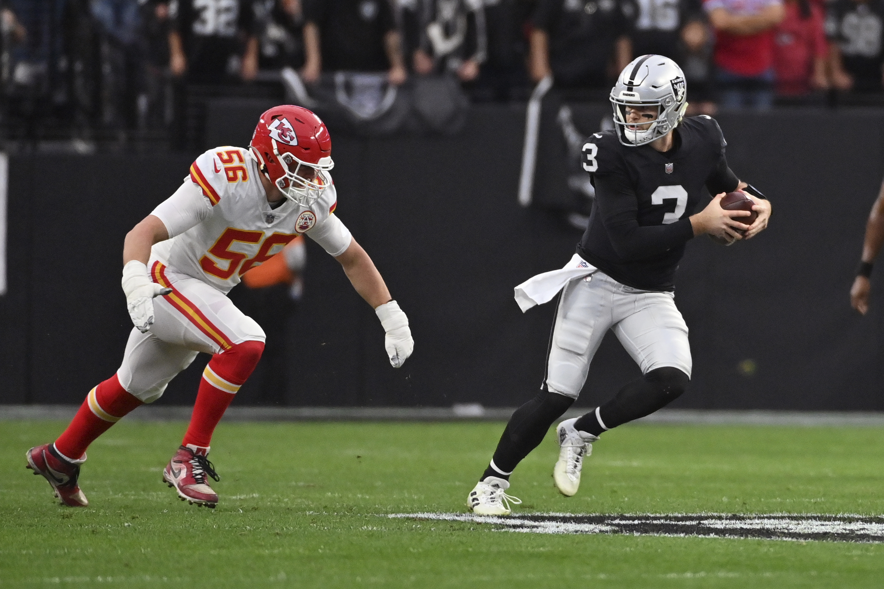 Raiders quarterback Derek Carr (4) is sacked by Kansas City Chiefs  cornerback L'Jarius Sneed (3 …