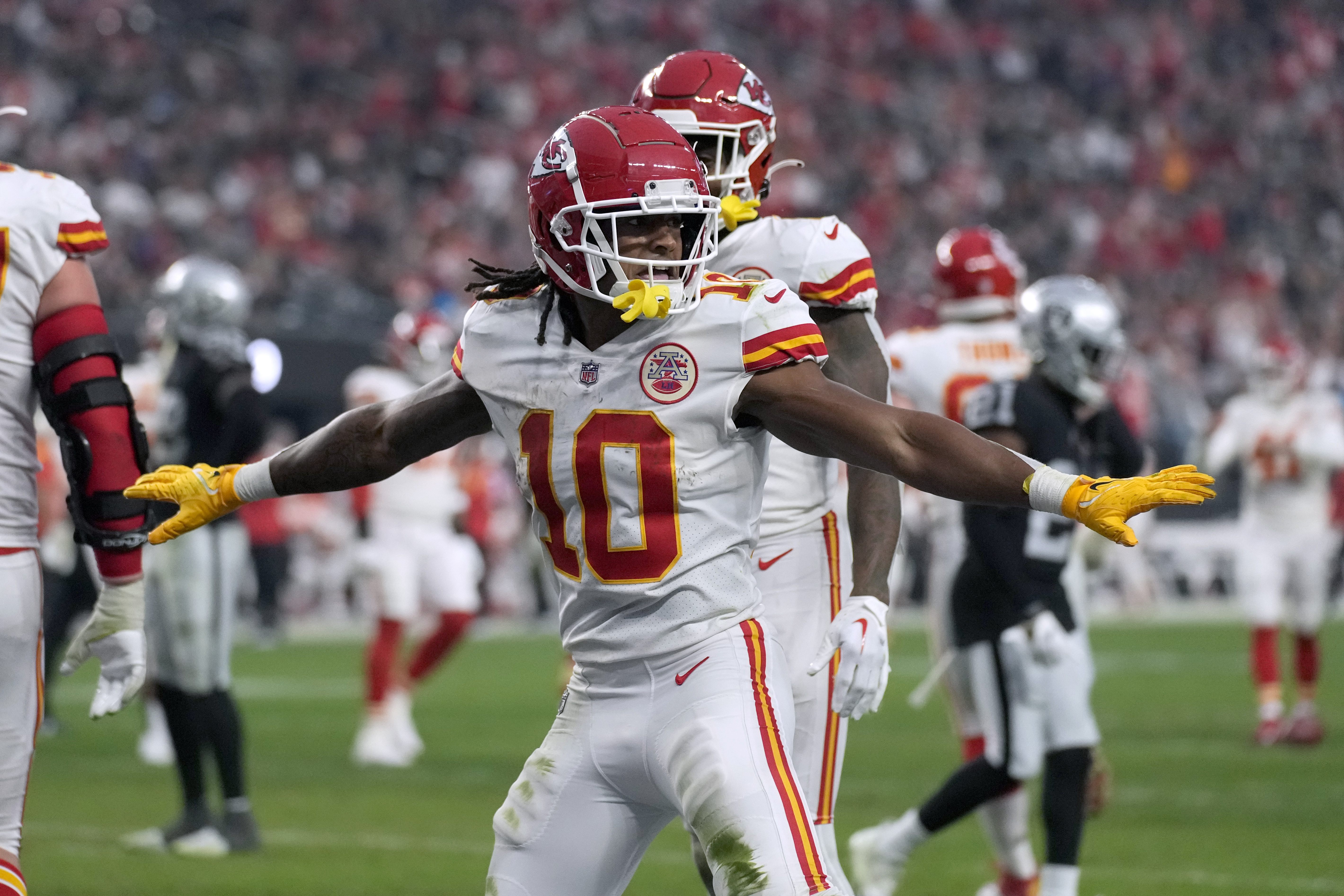 Kansas City Chiefs running back Jerick McKinnon (1) celebrates with  teammates after a Chiefs touchdown against the Las Vegas Raiders in an NFL  football game, Saturday, Jan. 7, 2023, in Las Vegas