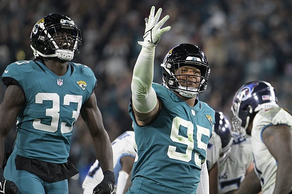 January 7, 2023: Tennessee Titans quarterback Joshua Dobbs (11) is sacked  by Jacksonville Jaguars defensive end Roy Robertson-Harris (95) during a  game in Jacksonville, FL. Romeo T Guzman/CSM/Sipa USA.(Credit Image: © Romeo