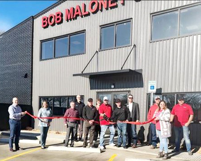 Courtesy photograph
City officials joined a ribbon cutting ceremony Monday morning for Bob Maloney Collision center on Slack Street.