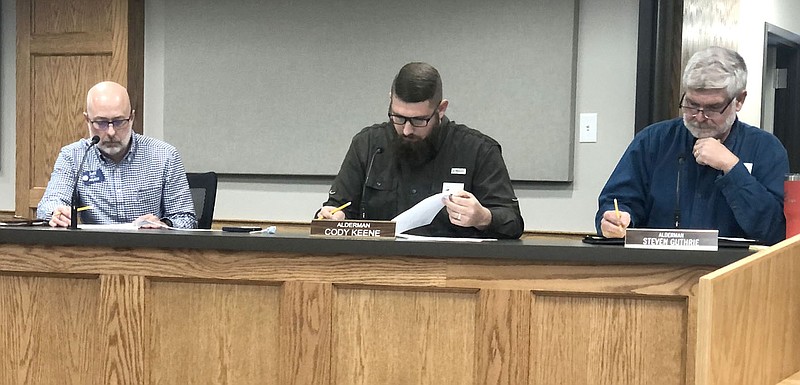 TIMES photograph by Annette Beard
Pea Ridge City Council met with six seats for the first time in the history of the city on Tuesday, Jan. 3. Looking over information to be acted up were council members Jeff Neil, Cody Keene and Steve Guthrie.