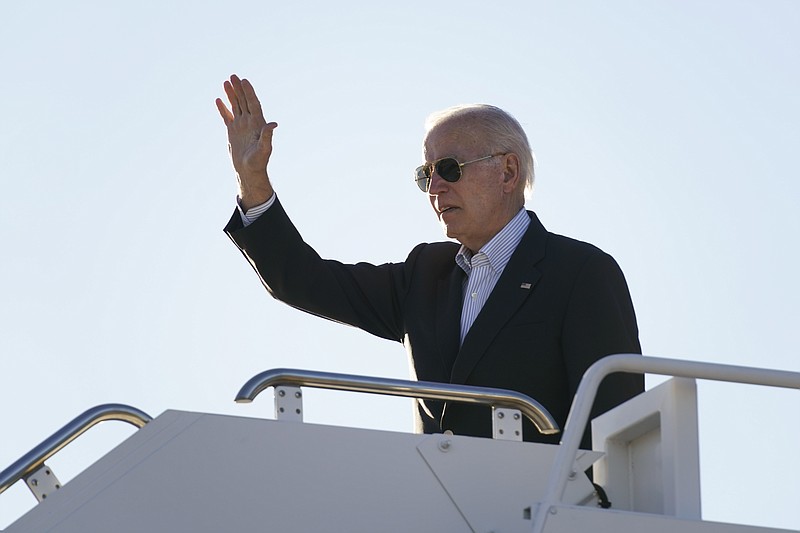 FILE - President Joe Biden waves before boarding Air Force One at El Paso International Airport in El Paso, Texas, Sunday, Jan. 8, 2023, to travel to Mexico City, Mexico. The Justice Department is reviewing a batch of potentially classified documents found in the Washington office space of President Joe Biden's former institute, the White House said Monday, Jan. 9. (AP Photo/Andrew Harnik)