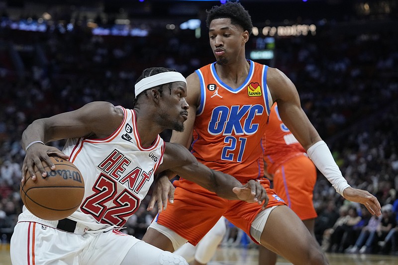 Miami Heat forward Jimmy Butler (22) dribbles the ball against Miami Heat  forward Jimmy Butler (22) during the third quarter in game one of the 2023  NBA Finals at Ball Arena.