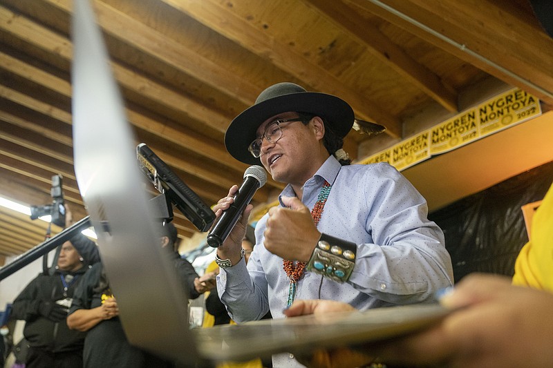 FILE - Buu Nygren announces his win for the Navajo Nation president as he reads tabulated votes from chapter houses across the reservation at his campaign's watch party at the Navajo Nation fairgrounds in Window Rock, Ariz., on Tuesday, Nov. 8, 2022. Nygren will be sworn in Tuesday, Jan. 10, 2023, as the next president of the vast Navajo Nation. It's a job that will test his ability to make good on promises to deliver water, electricity, and broadband to the tens of thousands who don't have it. (AP Photo/William C. Weaver IV, File)