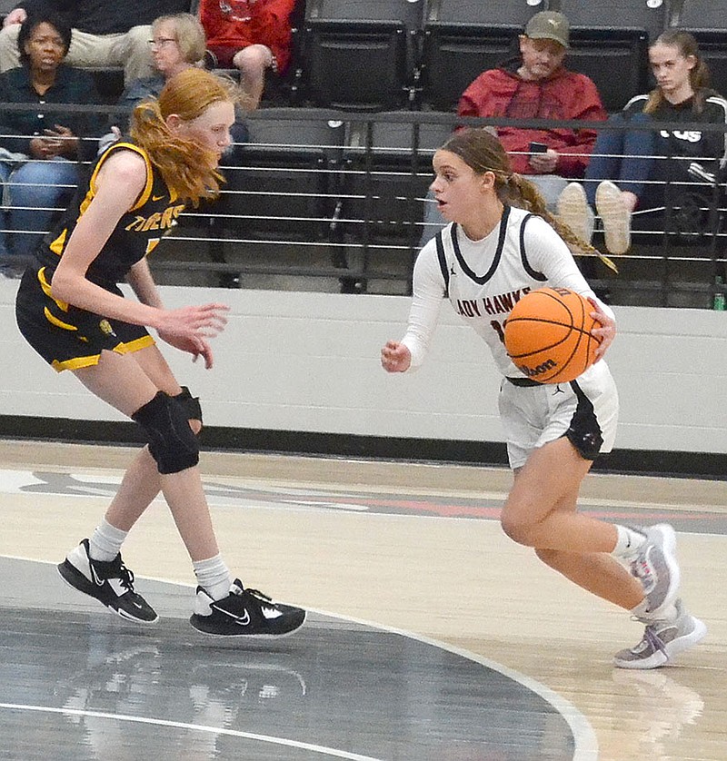 TIMES photograph by Annette Beard
Freshman Makenzie Stites, No. 11, drives toward the goal for a shot. The Lady Blackhawks hosted the Prairie Grove Lady Tigers Tuesday, Jan. 10, 2023. The Hawks fell to the Tigers 43-59.