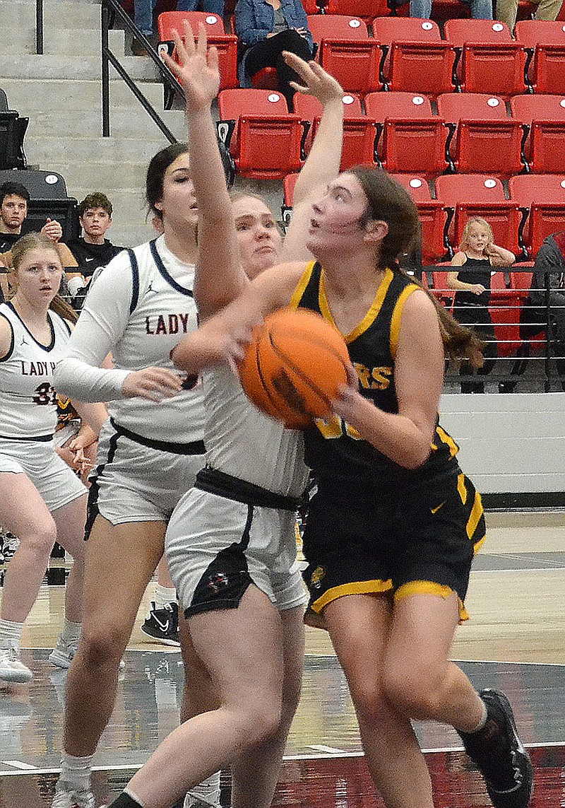Staff photographs by Annette Beard
Lady Tiger No. 35 works around Lady Blackhawk Rebecca Konkler, No. 22, in the lane Tuesday, Jan. 10, 2023, in Blackhawk Arena. The Lady Tigers defeated the Lady Blackhawks 59-43.