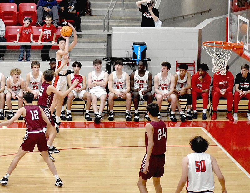 Mark Humphrey/Enterprise-Leader
Farmington sophomore Maddox Teeter launches a 3-point against Gentry. Teeter buried two 3-pointers and scored 14 points to tie for team scoring honors in Friday's 77-15 Colors Day runaway win by the Cardinals.