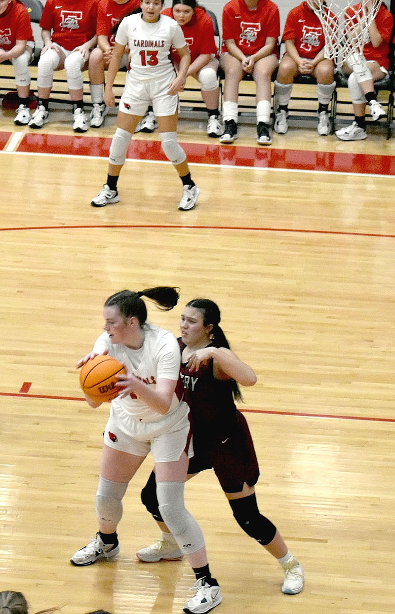 Mark Humphrey/Enterprise-Leader
Farmington sophomore Zoey Bershers posts up against a shorter Gentry defender. The 6-feet-3 center scored a team-high 16 points to lead Farmington to a 56-37 win over the Lady Pioneers on Friday as the Lady Cardinals celebrated Colors Day.