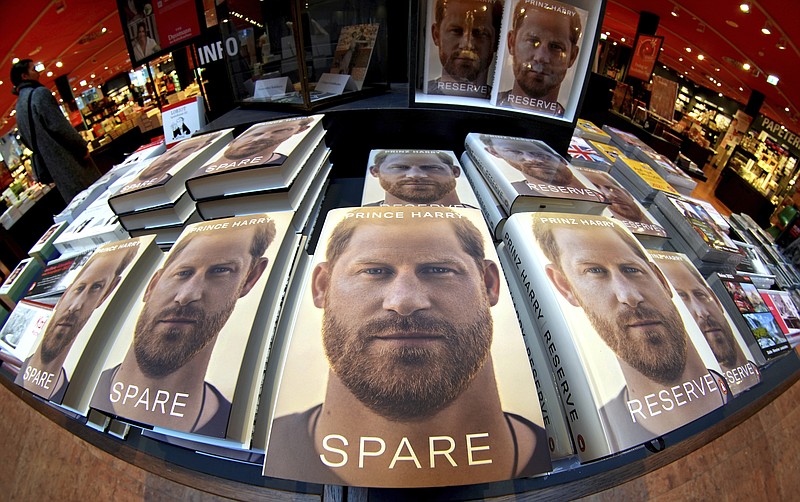 Copies of the new book by Prince Harry called "Spare" are displayed at a book store in Berlin, Germany, Tuesday, Jan. 10, 2023. Prince Harry's memoir "Spare" went on sale in bookstores on Tuesday, providing a varied portrait of the Duke of Sussex and the royal family. (AP Photo/Michael Sohn)