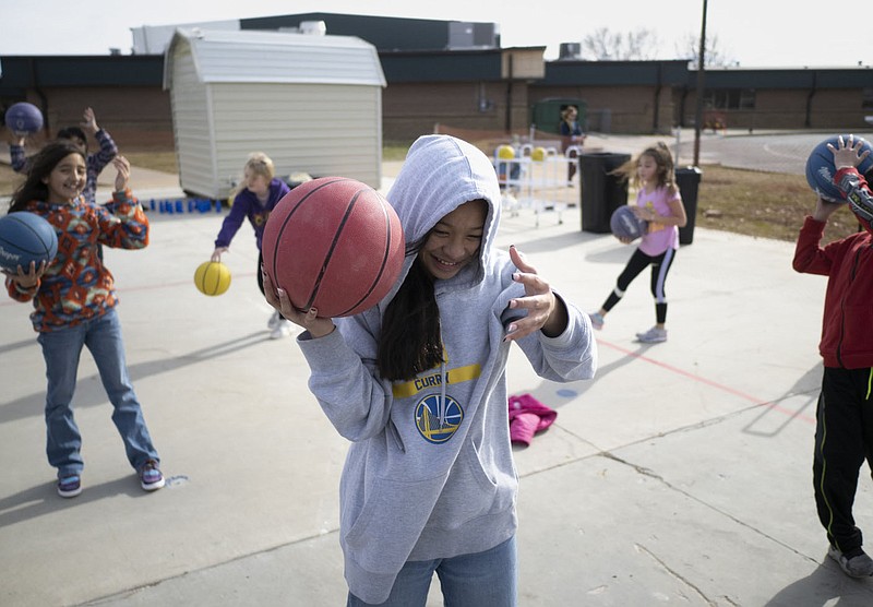 Noelani Harry practices basketball techniques, Monday, January 9, 2023 at George Elementary School in Springdale. Visit nwaonline.com/photos for today's photo gallery.

(NWA Democrat-Gazette/Charlie Kaijo)