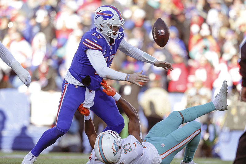 Buffalo Bills quarterback Josh Allen (17) reacts during the first half of  an NFL football game …