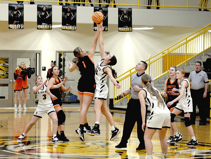 Enterprise-Leader/Mark Humphrey
Gravette junior Dalacie Wishon jumps center against Prairie Grove senior Kenleigh Elder. Wishon scored 10 points, but the Lady Lions lost a 4A-1 Conference girls' basketball game, 51-48, Friday.