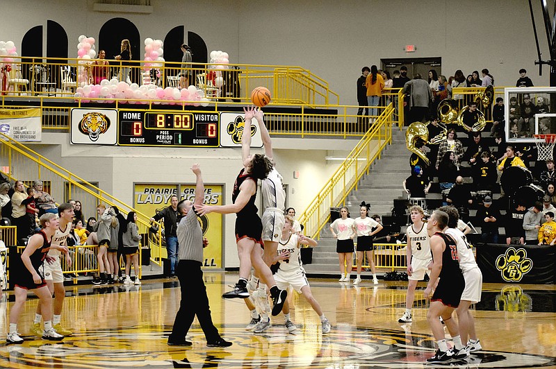 Enterprise-Leader/Mark Humphrey
Gravette’s Kais Patton jumps center against Prairie Grove. The Lions spoiled the Tigers’ colors day celebration with a 63-43 win in 4A-1 Conference boys basketball action Friday.