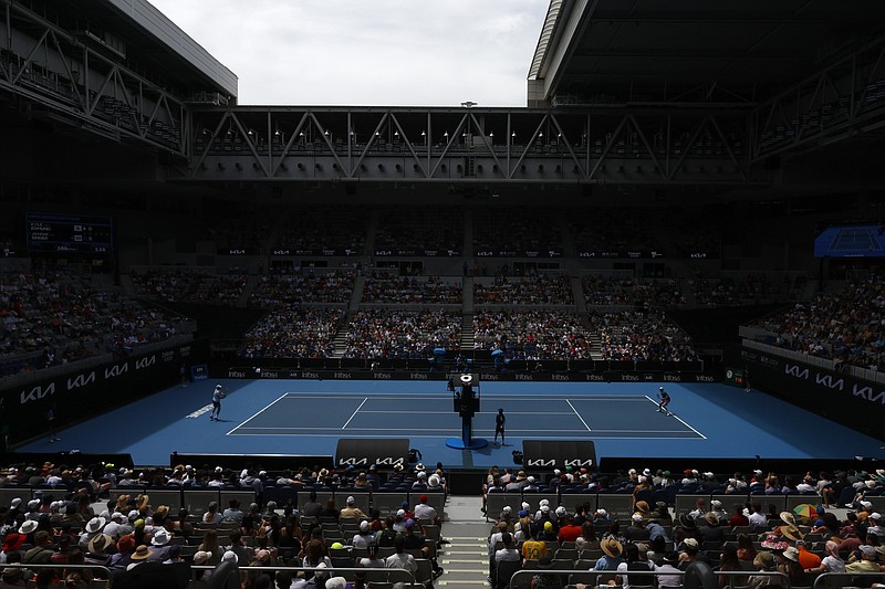 Kyle Edmund of Britain and Jannik Sinner of Italy play during their first round match at the Australian Open tennis championship in Melbourne, Australia, Monday, Jan. 16, 2023. (AP Photo/Asanka Brendon Ratnayake)