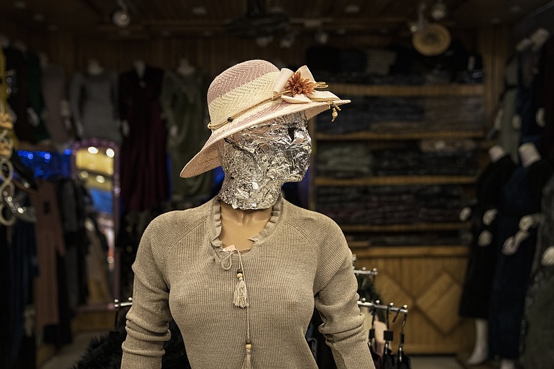 A mannequin's head is covered Dec. 26 in a woman dress shop in Kabul, Afghanistan. (AP/Ebrahim Noroozi)