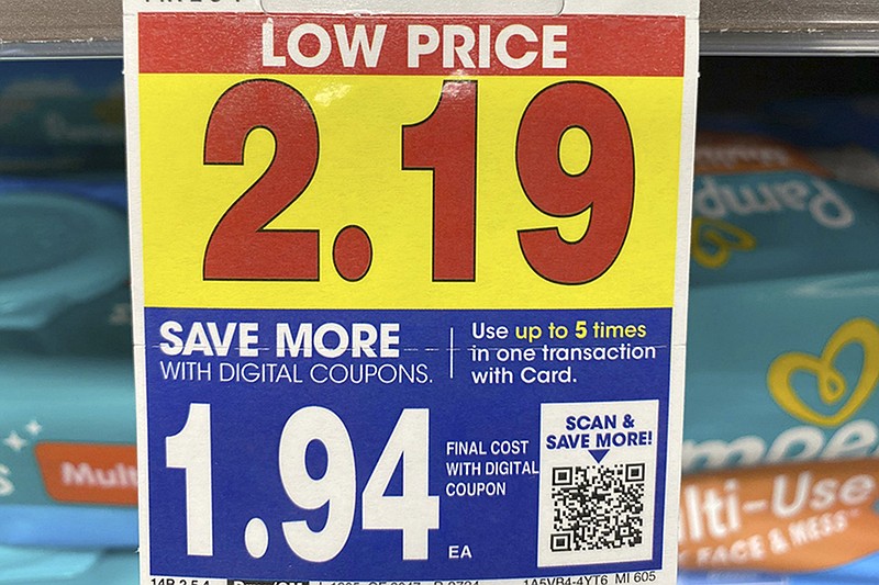 A digital-only coupon for baby wipes is displayed at a Kroger in Michigan, on Nov. 16, 2022. (AP Photo/Dee-Ann Durbin)