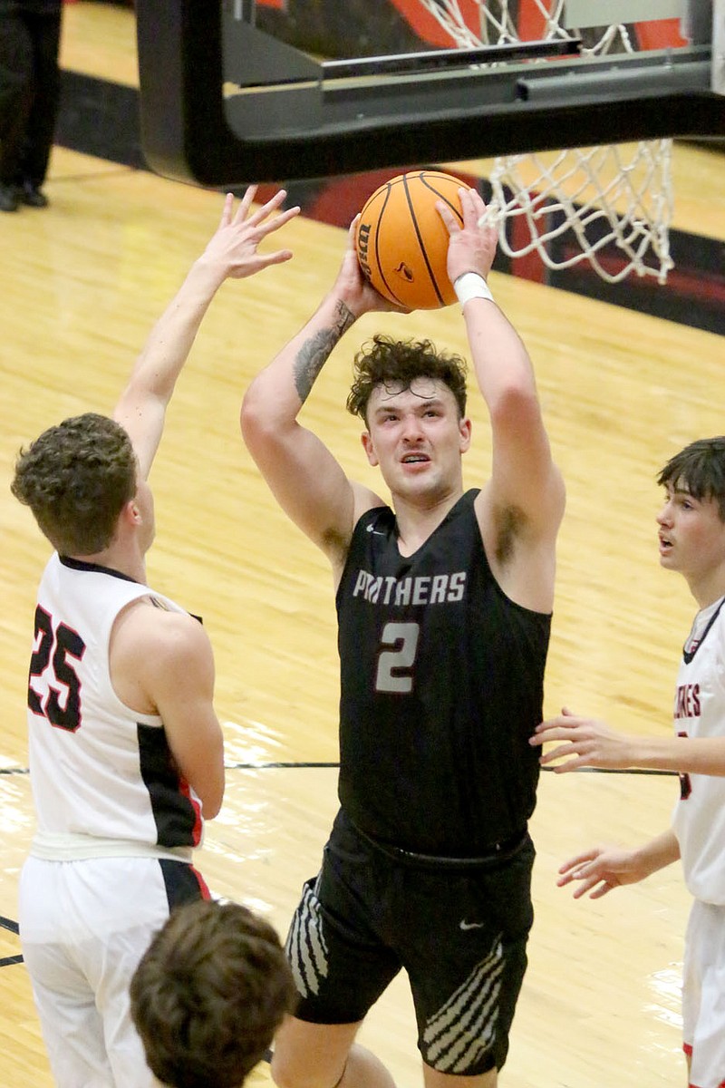 Mark Ross/Special to the Herald-Leader
Siloam Springs senior Dalton Newman fights through Russellville's defense for a shot on Friday, Jan. 20, at Cyclone Arena. Newman scored 17 points as the Panthers defeated the Cyclones 45-38.