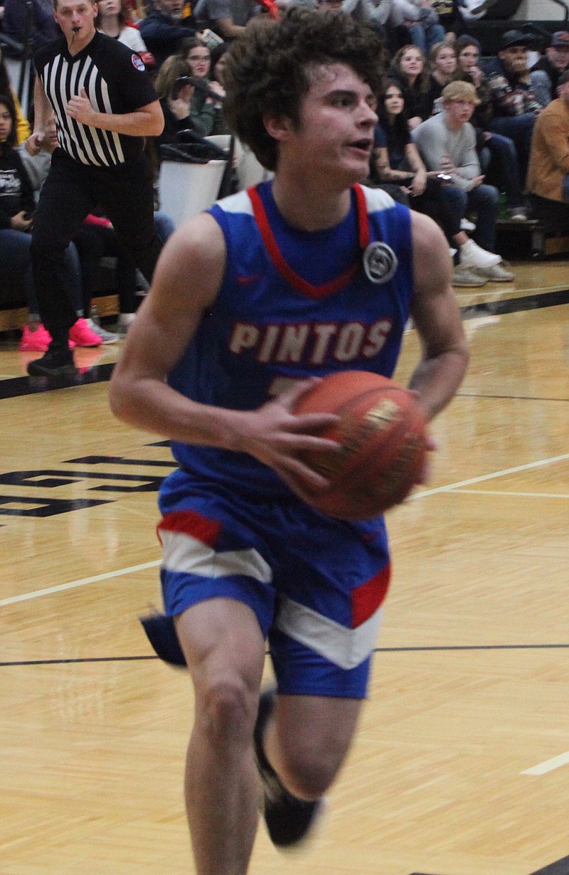 Sophomore guard Hayden Kilmer makes a steal and makes a breakaway layup for California. Kilmer had 10 points, five rebounds, and two steals for the Pintos on Friday. (Democrat photo/Evan Holmes)