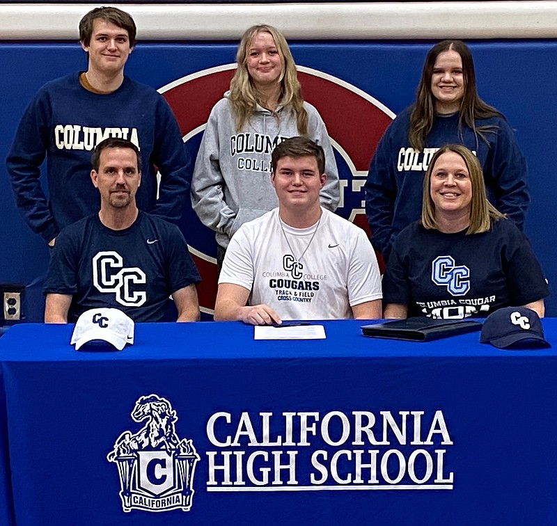 California High School track & field senior Griffin Booth (bottom row center) committed to Columbia College on Friday with family, friends, and coaches in attendance. (Democrat photo/Evan Holmes)