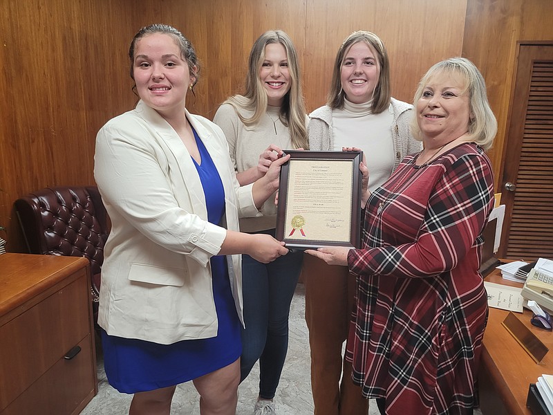 Photo by Bradly Gill
Future Business Leaders of America members Allie Hicks, Madison Richarson and Isabella Knight hold a proclamation from Camden Mayor Charlotte Young proclaiming FBLA in Camden.