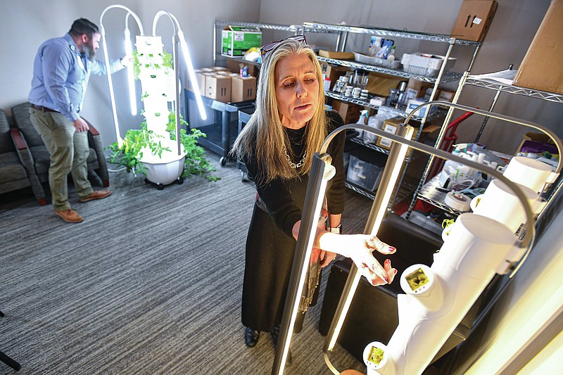 Elizabeth McClain, Arkansas Colleges of Health Education chief wellness officer, and Blake Metcalf, ACHE director of clinical and community nutrition, tend to tower gardens, Thursday, Jan. 26, 2023, at the ACHE Research Institute Health and Wellness Center in Fort Smith. ACHE received approval from the Higher Learning Commission to begin a new master of public health degree, which will offer two concentration areas in nutrition and rural and community health, starting in the 2024 fall semester. Visit nwaonline.com/photo for today's photo gallery.
(NWA Democrat-Gazette/Hank Layton)