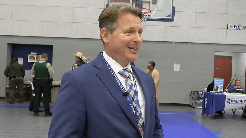 Chuck Ragsdale, a career coach with National Park College who works with Jessieville students, talks about the community career fair that was held at Jessieville Thursday for North Garland County adults seeking employment. - Photo by Lance Porter of The Sentinel-Record