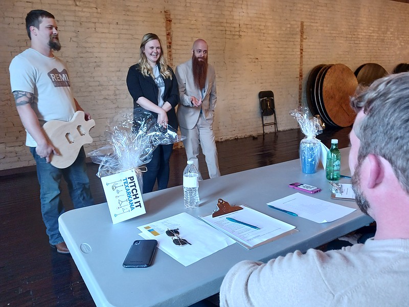 The crew of REMI Guitars run their idea past a panel of judges at Pitch It Texarkana on Thursday, March 31, 2022, at Crossties in Texarkana, Arkansas. REMI Guitars staff includes Daniel Rushing, Haley Rushing-Hill and Smokey Crabtree. (Staff file photo)