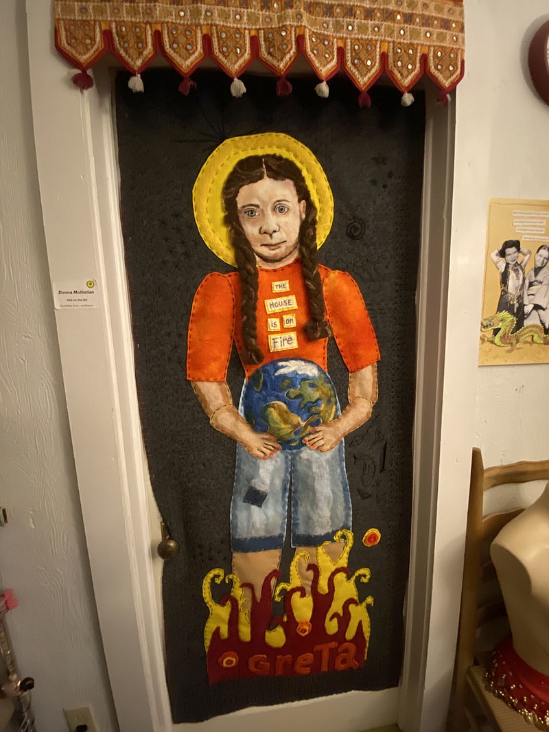 "The house is on fire," reads Greta Thunberg’s shirt in this (nearly life size) needle-felted image of the 4-foot-10 climate activist. This piece along with several others by Donna Mulhollan will provide a backdrop to a series of events in February featuring music and conversations about craftivism and climate change. (NWA Democrat-Gazette/Monica Hooper)