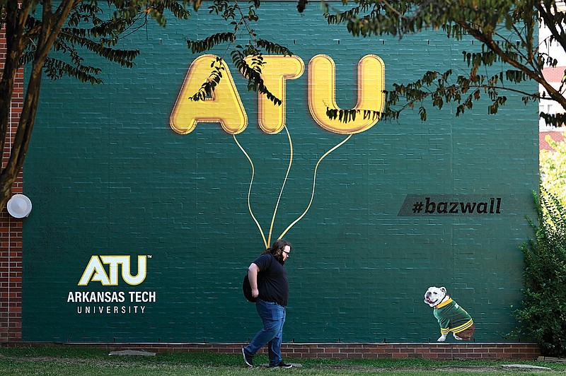 A student walks past a mural Oct. 5 on the Arkansas Tech University campus in Russellville.
(File Photo/Arkansas Democrat-Gazette/Stephen Swofford)