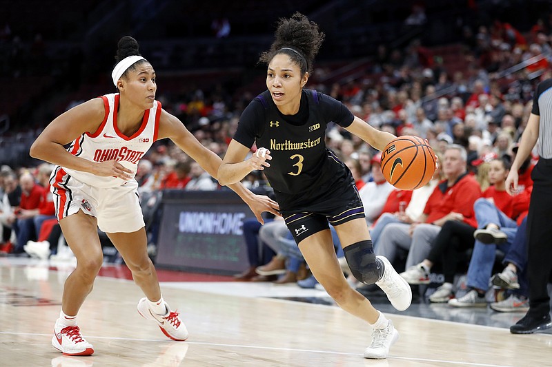 Northwestern guard Sydney Wood (3) dribbles past Ohio State forward Taylor Thierry, left, during the first half of an NCAA college basketball game at Value City Arena in Columbus, Ohio, Thursday, Jan. 19, 2023. (AP Photo/Joe Maiorana)