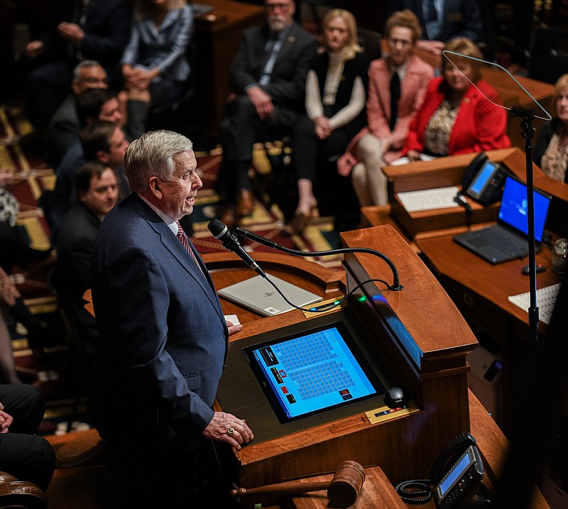 Julie Smith/News Tribune photo: 
Missouri Gov. Mike Parson is shown at the speaker's podium Jan. 18, 2023, as he delivers the annual State of the State speech in the House of Representatives Chamber. The speech was paused numerous times as members of the joint session of legislators stood to applaud.