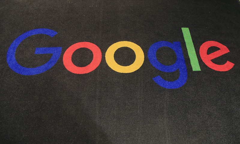 FILE - The logo of Google is displayed on a carpet at the entrance hall of Google France in Paris, on Nov. 18, 2019. Google said Friday, jan. 20, 2023, it&#x2019;s laying off 12,000 workers, becoming the latest tech company to trim staff after rapid expansions during the COVID-19 pandemic have worn off. (AP Photo/Michel Euler, File)