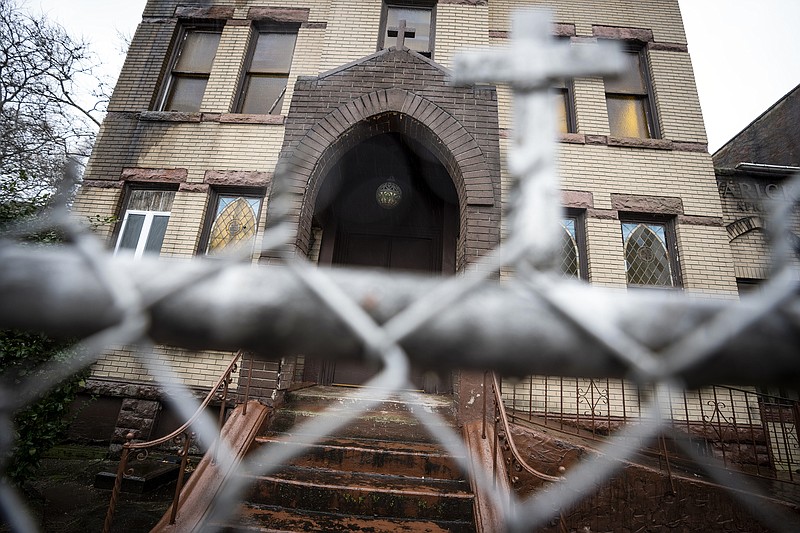 A rusted fence surrounds the Varick Memorial AME Zion Church, Thursday, Jan. 19, 2023, in the Brooklyn borough of New York. On Friday, a fund established to preserve historic Black churches in the United States formally revealed the first 35 houses of worship that will receive financial grants totaling $4 million. (AP Photo/John Minchillo)