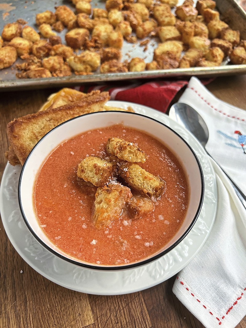 Homemade tomato soup topped with crunchy, cheesy croutons is an easy mid-week meal. (Gretchen McKay/Pittsburgh Post-Gazette/TNS)