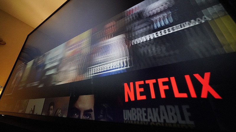 This is the NETFLIX screen on a television in Pittsburgh, on Monday, Oct. 17, 2022.  Netflix reports earnings on Thursday, Jan. 19, 2023.   (AP Photo/Gene J. Puskar)