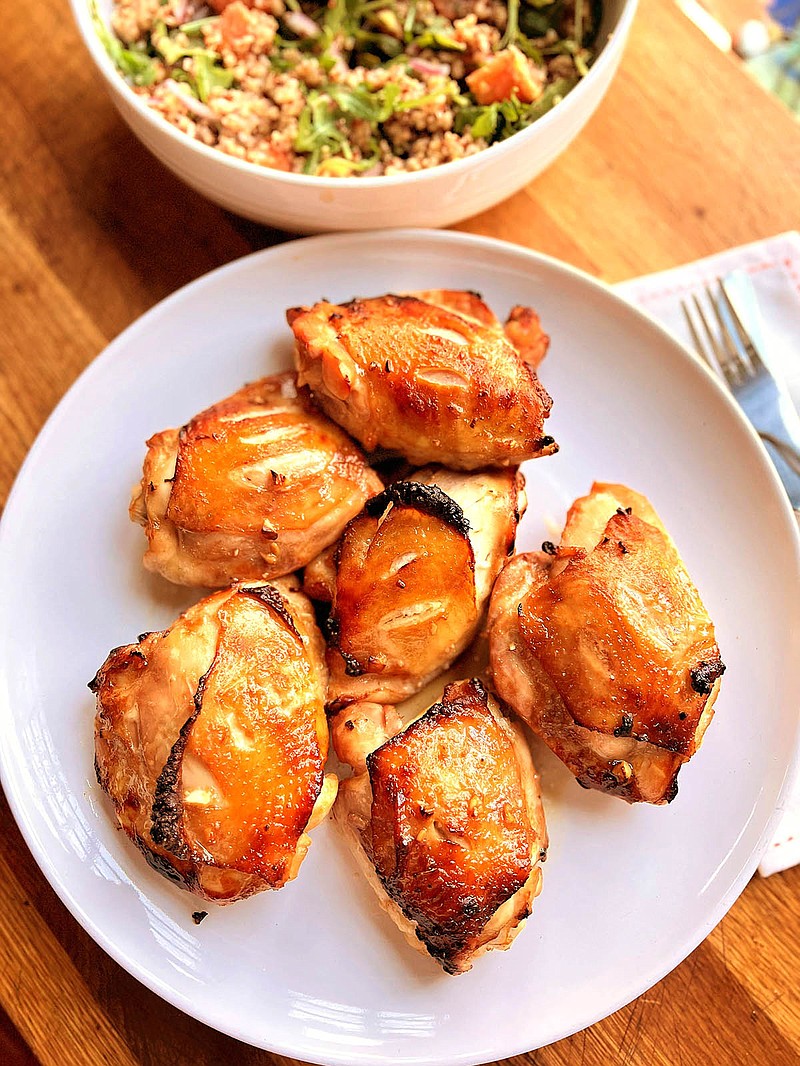 Roasted chicken thigh marinated in a mix of soy, rice wine and white miso is paired with a multi-grain salad. (Gretchen McKay/Pittsburgh Post-Gazette/TNS)