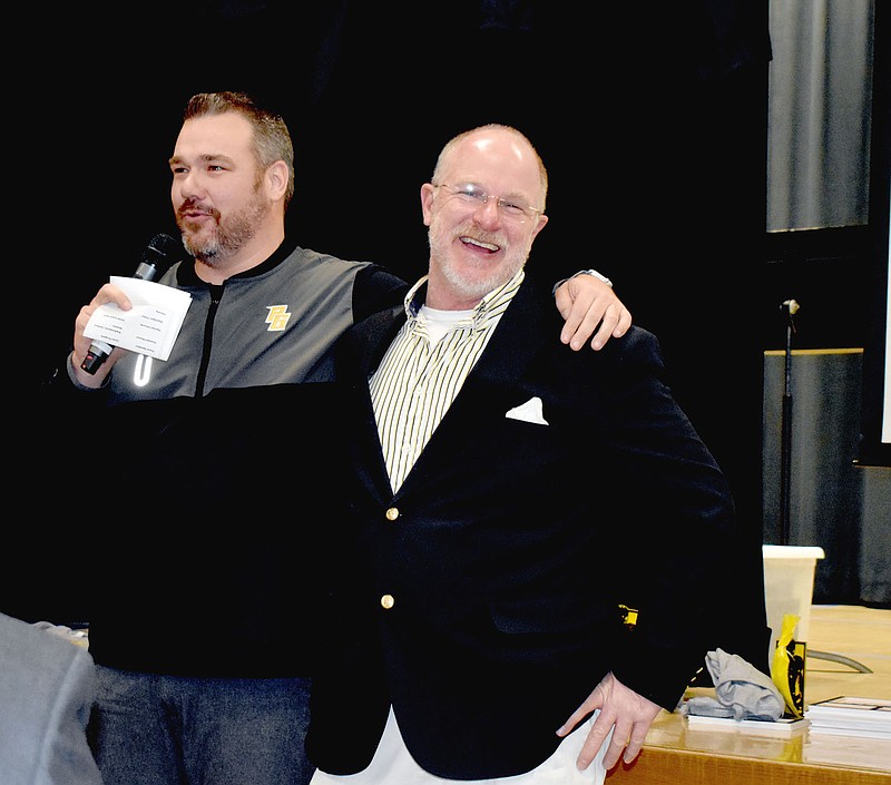 Mark Humphrey/Enterprise-Leader

Prairie Grove head football coach Danny Abshier (right) enjoys a laugh while sharing the podium with Prairie Grove High School Principal Jed Davis, a former football coach, during Saturday's Tiger football awards banquet. Abshier stated he thinks Davis might make a good superintendent. The district has been operating with assistant superintendent Pete Joenks functioning as interim superintendent since the resignation of Reba Holmes in November.