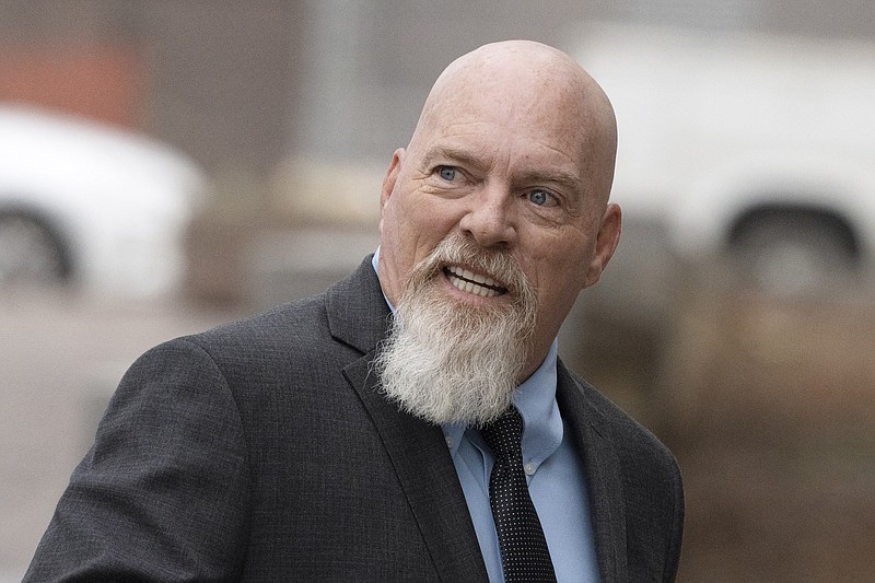 FILE - Richard Barnett, an Arkansas man who was photographed with his feet on a desk in former House Speaker Nancy Pelosi's office during the Jan. 6 U.S. Capitol riot, arrives at federal court in Washington, Jan. 10, 2023.  A jury deliberated for approximately two hours before unanimously convicting Barnett on all eight counts in his indictment, including felony charges of civil disorder and obstruction of an official proceeding. (AP Photo/Manuel Balce Ceneta, File)