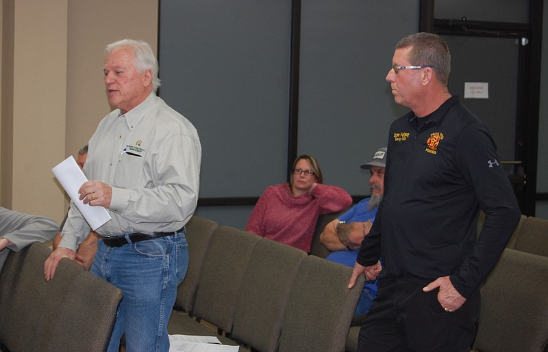 Bennett Horne/The Weekly Vista Bella Vista Deputy Fire Chief Bryan Wolfgang (right) listens as Clinard Construction Management President Mark Clinard discusses the Towncenter fire station remodel project with the City Council during its Jan. 17 work session.